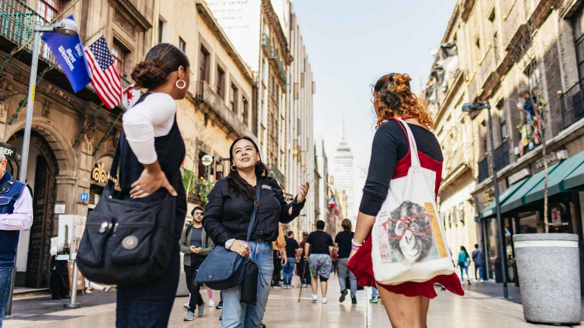 A walking group in front of the Metropolitan Cathedral on the Zócalo, historic downtown walking tour in Mexico City