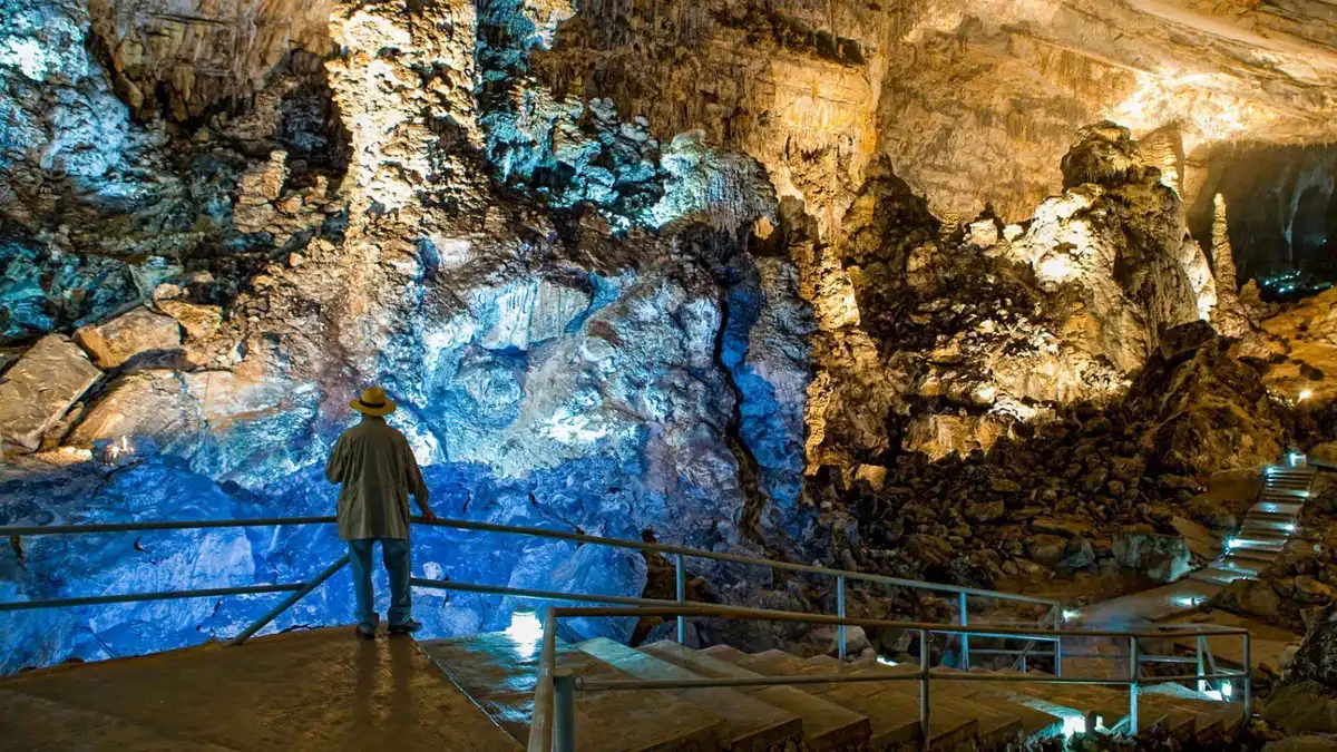 The vaulted chambers of the Cacahuamilpa caves lit for visitors, on a Taxco and Cuernavaca day tour from Mexico City
