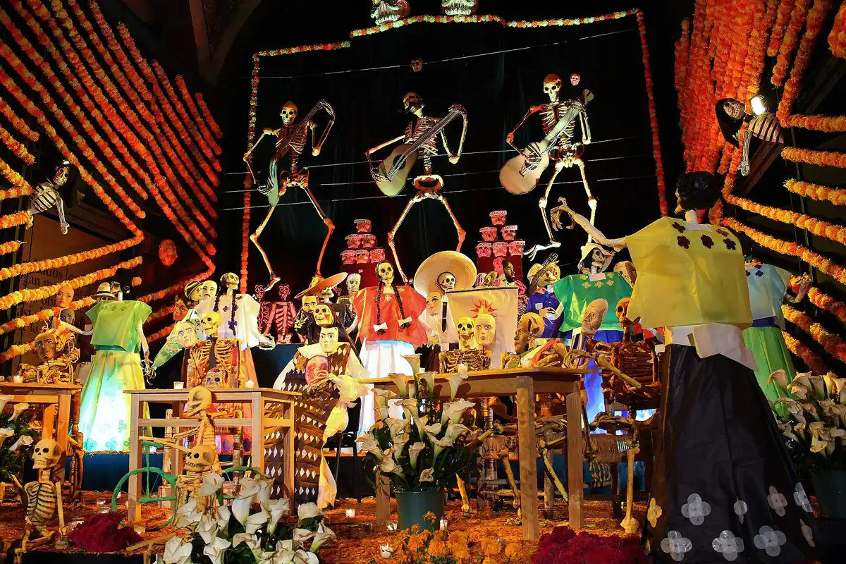 A monumental Día de Muertos ofrenda with marigold garlands and papier-mâché skeletons, the November date that changes a visit to Mexico City