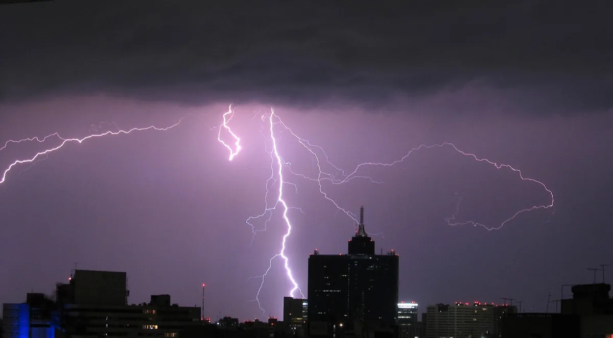 Lightning over the Mexico City skyline at night, the punctual afternoon storms of the June to September rainy season